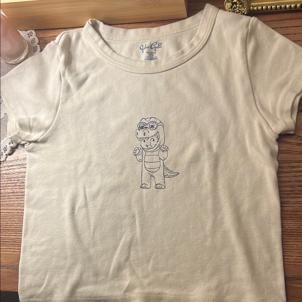 John Galt baby tee with dinosaur print